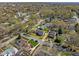 Aerial view of the property showcasing its prime location within a tree-lined neighborhood; yellow property lines included at 1106 Aycock Ave, Burlington, NC 27215
