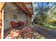 Covered back porch with seating and a view of the yard at 1106 Aycock Ave, Burlington, NC 27215