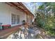 Backyard patio with an outdoor kitchen and seating area under a covered porch at 1106 Aycock Ave, Burlington, NC 27215