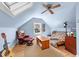 Cozy bedroom with a skylight, ceiling fan, and seating area at 1106 Aycock Ave, Burlington, NC 27215