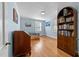 Bright bedroom featuring hardwood floors, two windows, and built-in bookshelves at 1106 Aycock Ave, Burlington, NC 27215