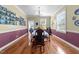 Formal dining room with natural light, hardwood floors, and room for entertaining at 1106 Aycock Ave, Burlington, NC 27215