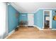 Inviting entryway features hardwood floors and light blue walls with white trim at 1106 Aycock Ave, Burlington, NC 27215