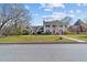 Classic two-story home with a charming front porch, well-manicured lawn, and inviting curb appeal at 1106 Aycock Ave, Burlington, NC 27215
