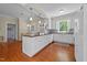 Spacious kitchen featuring white cabinets, an island, and stainless steel appliances at 1106 Aycock Ave, Burlington, NC 27215