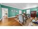 Inviting living room with ample seating, a fireplace, and hardwood floors at 1106 Aycock Ave, Burlington, NC 27215