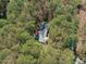 Aerial view of the property surrounded by lush green trees for privacy at 11808 Black Horse Run, Raleigh, NC 27613