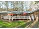Expansive backyard featuring a large deck and lush green lawn, perfect for outdoor activities at 11808 Black Horse Run, Raleigh, NC 27613