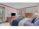 Bedroom with large glass doors to outside and hardwood trim at 11808 Black Horse Run, Raleigh, NC 27613