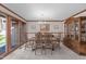 Elegant dining room with hardwood floors, chandelier lighting, and large picture window at 11808 Black Horse Run, Raleigh, NC 27613