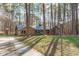 Charming single-story home with brick accents, a well-maintained lawn, and mature trees at 11808 Black Horse Run, Raleigh, NC 27613