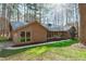 Charming single-story home with brick accents, a well-maintained lawn and mature landscaping at 11808 Black Horse Run, Raleigh, NC 27613
