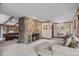Inviting living room boasts a stone fireplace and plush seating at 11808 Black Horse Run, Raleigh, NC 27613