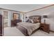 Spacious main bedroom featuring a luxurious bed, a dresser, and serene natural light at 11808 Black Horse Run, Raleigh, NC 27613