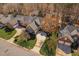 Beautiful home with manicured lawns, mature trees, and a long driveway leading to an attached garage at 1217 Wedgeland Dr, Raleigh, NC 27615