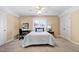 Cozy bedroom features a ceiling fan, window, and furniture at 1217 Wedgeland Dr, Raleigh, NC 27615