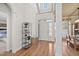 Bright foyer with hardwood floors, a high ceiling and a decorative plant stand at 1217 Wedgeland Dr, Raleigh, NC 27615