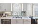 Kitchen sink with stainless steel appliances and granite countertops offers modern functionality at 1217 Wedgeland Dr, Raleigh, NC 27615