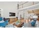 Open-concept living room with hardwood floors and a high ceiling at 1217 Wedgeland Dr, Raleigh, NC 27615