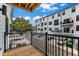 Private balcony overlooks the parking area and manicured surroundings, perfect for relaxing outdoors at 1226 Coach Station Alley # 101, Raleigh, NC 27601