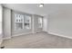 A spacious bedroom with multiple windows allowing natural light at 1226 Coach Station Alley # 101, Raleigh, NC 27601