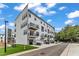 Modern townhouse complex showcases a stylish facade, balconies, and front-facing garages for convenient living at 1226 Coach Station Alley # 101, Raleigh, NC 27601