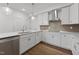 Bright kitchen featuring white cabinetry, quartz countertops, and stainless steel appliances at 1226 Coach Station Alley # 101, Raleigh, NC 27601