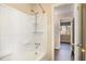 Bathroom with white tile and fixtures, complemented by simple accessories, and direct access to bedroom at 1245 Schaub Dr, Raleigh, NC 27606