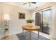 A sunlit dining area offers a wood table, stylish rug, and sliding glass doors at 1245 Schaub Dr, Raleigh, NC 27606