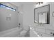 Stylish bathroom with soaker tub, updated vanity, and a large mirror at 1318 Ivy Ln, Raleigh, NC 27609