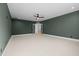 Large bonus room features neutral carpet and double doors that let in ample light at 1318 Ivy Ln, Raleigh, NC 27609