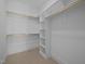Walk-in closet featuring built-in shelving and rods for ample storage at 1318 Ivy Ln, Raleigh, NC 27609