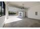 Spacious two-car garage with open door, concrete floor, and bright lighting at 1318 Ivy Ln, Raleigh, NC 27609