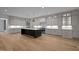 Expansive kitchen featuring a spacious island, stainless steel appliances, and a chef's dream layout at 1318 Ivy Ln, Raleigh, NC 27609