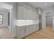 Bright kitchen area with marble countertops, stainless steel refrigerator, and modern cabinetry, for any chef at 1318 Ivy Ln, Raleigh, NC 27609