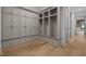 Mudroom features custom gray built-ins, bench seating, and hardwood floors at 1318 Ivy Ln, Raleigh, NC 27609
