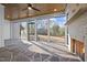 Enclosed sunroom with stone flooring, fireplace, wood ceiling, and views of the backyard at 1318 Ivy Ln, Raleigh, NC 27609