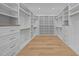 Large walk-in closet with custom shelving and drawer units at 1318 Ivy Ln, Raleigh, NC 27609