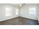 Spacious bedroom with hardwood flooring and multiple windows at 133 Ambergate Ct, Rocky Mount, NC 27804