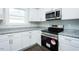 Modern kitchen features stainless steel appliances, granite countertops, and ample cabinet space at 133 Ambergate Ct, Rocky Mount, NC 27804