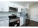Updated kitchen with stainless appliances, stylish countertops, and ample storage space at 133 Ambergate Ct, Rocky Mount, NC 27804
