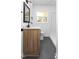 Well-lit bathroom with wooden vanity, updated fixtures, and a shower at 1409 Ida St, Durham, NC 27705