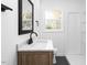 Bright bathroom with sleek vanity, updated fixtures, and a shower at 1409 Ida St, Durham, NC 27705