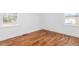 Bedroom features fresh paint, base trim and beautifully refinished hardwood floors at 1409 Ida St, Durham, NC 27705