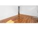 Freshly painted bedroom featuring refinished hardwood floors and modern outlets at 1409 Ida St, Durham, NC 27705