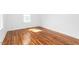 Bright bedroom with refinished hardwood floors and fresh paint at 1409 Ida St, Durham, NC 27705