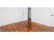 Bright bedroom featuring refinished hardwood floors, fresh paint and a closet at 1409 Ida St, Durham, NC 27705
