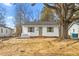 Charming home with white picket fence and a large tree in the front yard at 1409 Ida St, Durham, NC 27705
