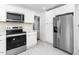 Open kitchen with stainless steel appliances and ample counter space at 1409 Ida St, Durham, NC 27705