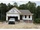 Image of a new home under construction with brick foundation and framed porch at 151 Tigris Ct, Zebulon, NC 27597
